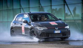 Auto Express Summer Tyre Test 2025 - header image showing a Volkswagen Golf undergoing wet weather cornering 